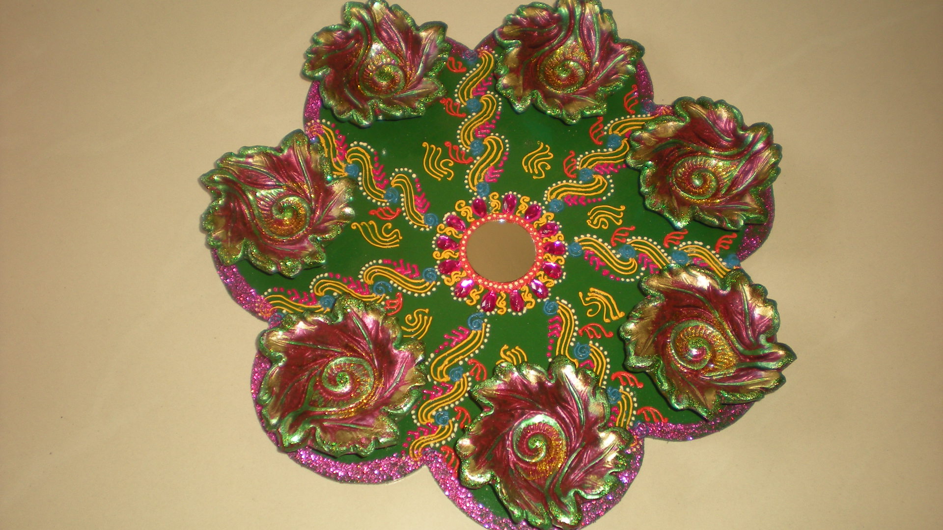 Manufacturers Exporters and Wholesale Suppliers of Rangoli diya plates 04 Nagpur Maharashtra